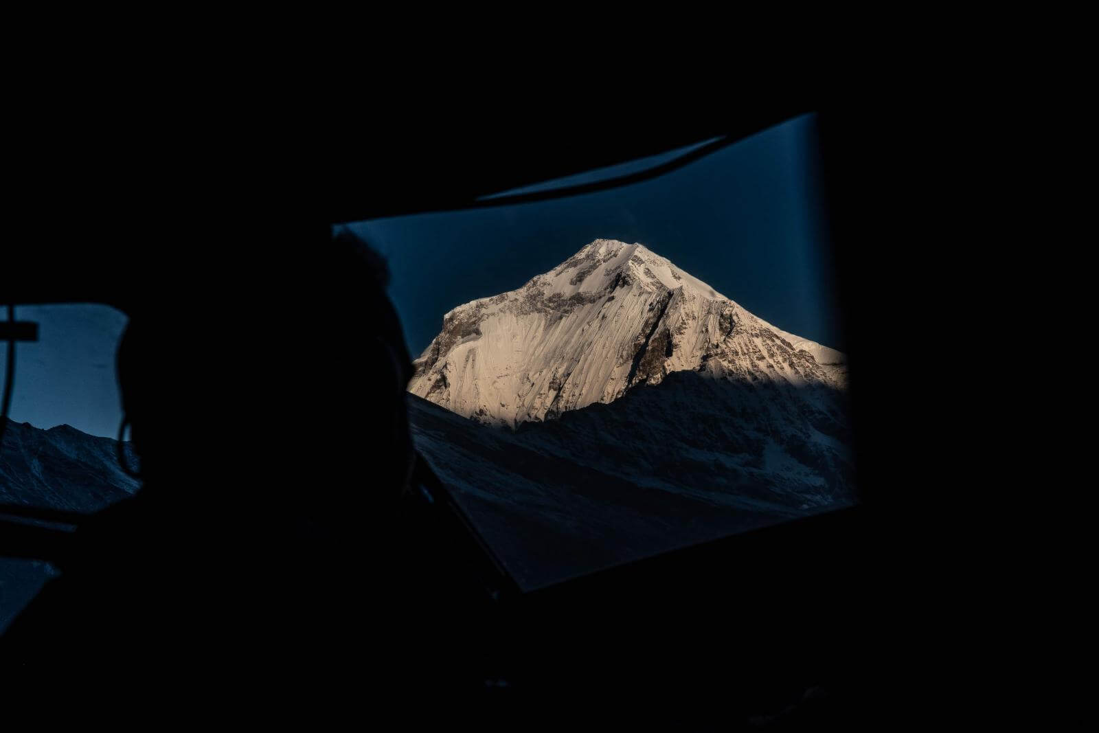 Nepal Mountain from airplane window as the author heads to the bike tour destination